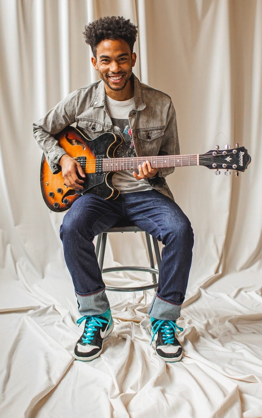 angle hover: resin rinse | A model wears Raleigh Denim Workshop Alexander work fit jeans with a dark wash, front view