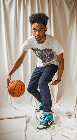 angle: resin rinse | A model wears Raleigh Denim Workshop Alexander work fit jeans with a dark wash, front view