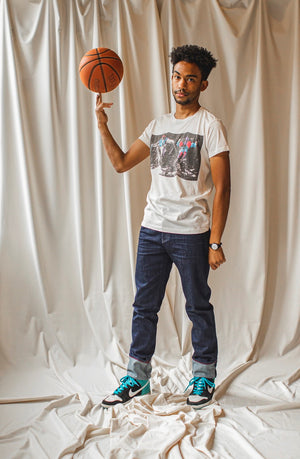 angle: resin rinse | A model wears Raleigh Denim Workshop Alexander work fit jeans with a dark wash, front view