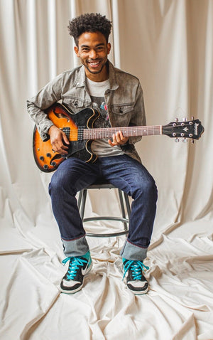 angle hover: resin rinse | A model wears Raleigh Denim Workshop Alexander work fit jeans with a dark wash, front view