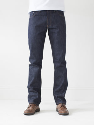 angle: 211 | A model wears Raleigh Denim Workshop Jones thin fit selvage raw jeans, front view