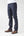 angle: 211 | A model wears Raleigh Denim Workshop Jones thin fit selvage raw jeans, side view